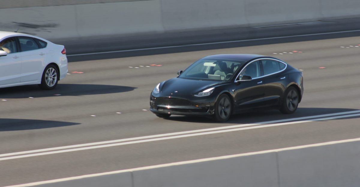 A black Tesla Model 3 driving in the southbound lanes of Oran K Gragson Freeway U S 95 Las Vegas Nevada