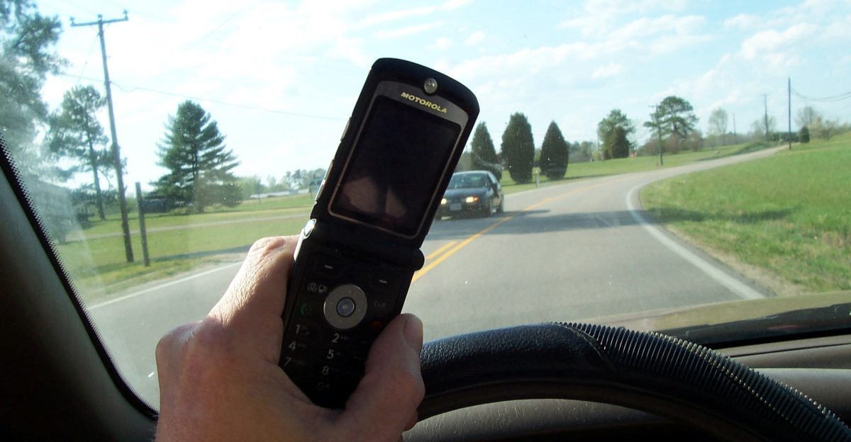 Person using cell phone while driving