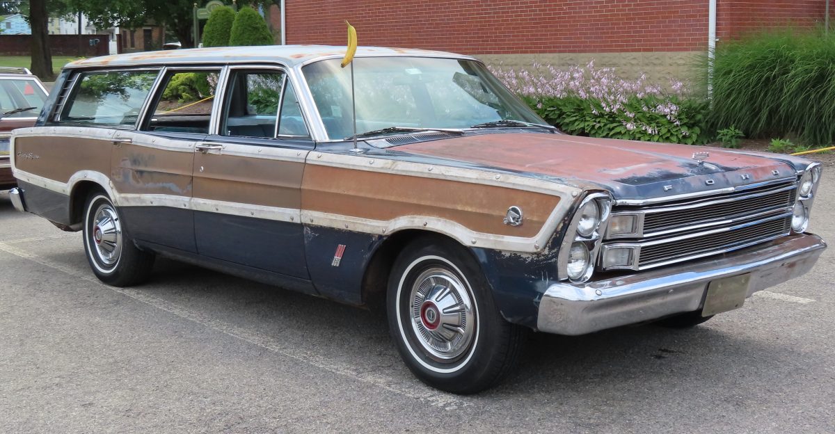 Ford Country Squire photographed at the July 15 2023 International Station Wagon Club meet in Butler Pennsylvania Finished in Nightmist Blue Poly I don t know what the banana is doing there either