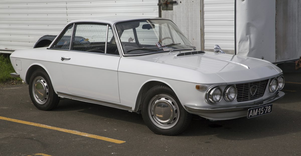 cc tipo 818 130 a late Series I coup Still with the aluminium doors hood and trunklid Resprayed a somewhat brighter white than original otherwise as Lancia meant it to be Sold new in Bergamo spent some time in the Netherlands hence the plates before coming to the Northeast US In the parking lot of the 2018 Greenwich Concours d Elegance
