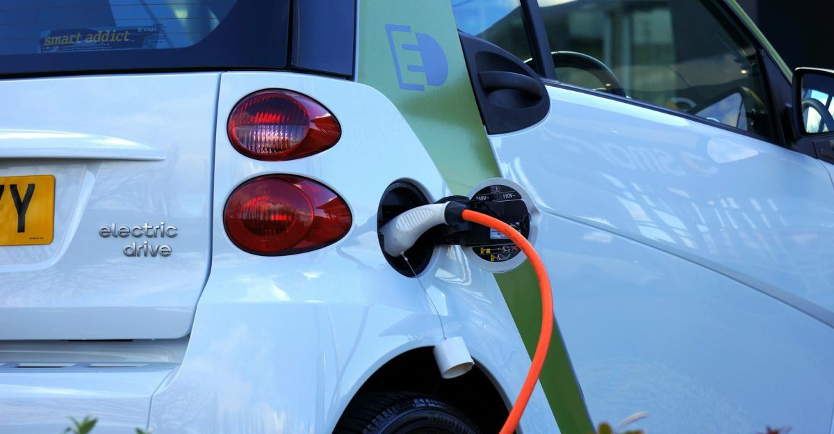 Close-up of an electric car being charged highlighting eco-friendly transportation