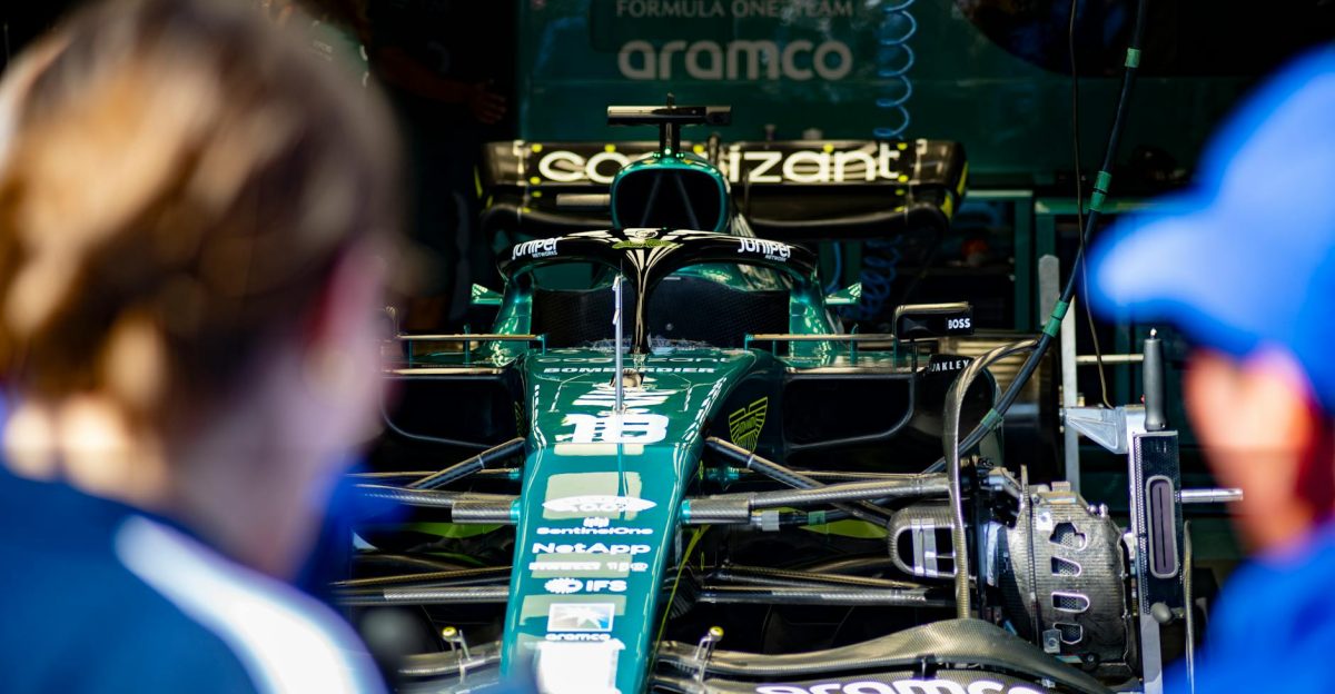 Aston Martin Formula 1 race car being prepared in the team garage before competition