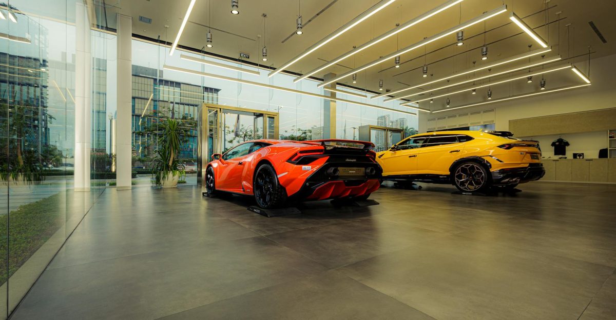 Showroom featuring luxury sports cars Lamborghini models with sleek design and modern architecture