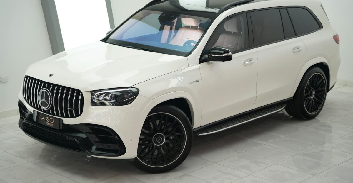 A sleek and luxurious modern SUV displayed in an indoor car showroom