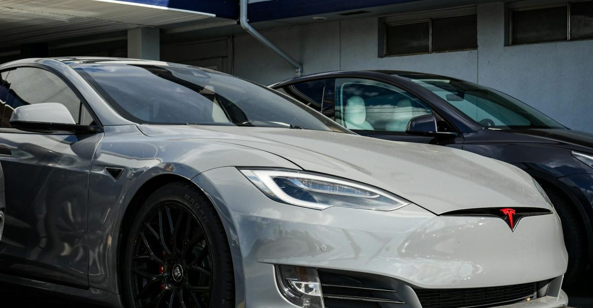 Close-up view of a sleek Tesla Model S parked outdoors showcasing modern electric vehicle design