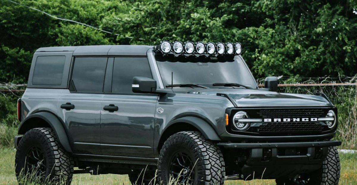 Gray Ford Bronco SUV parked outdoors showcasing off-road capabilities with large tires