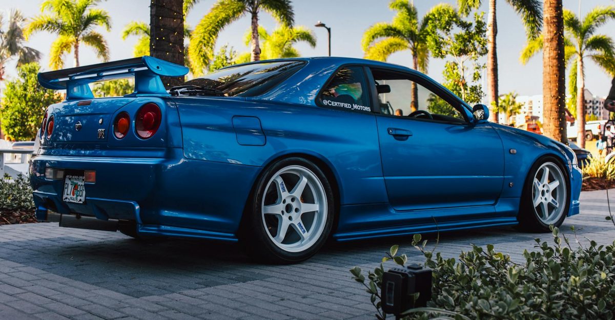 Stunning blue Nissan GT-R R34 showcased at a car event in Tampa Florida