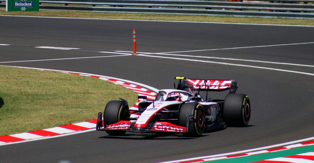 Dynamic shot of a Formula 1 car speeding around a corner at Hungaroring Mogyor d