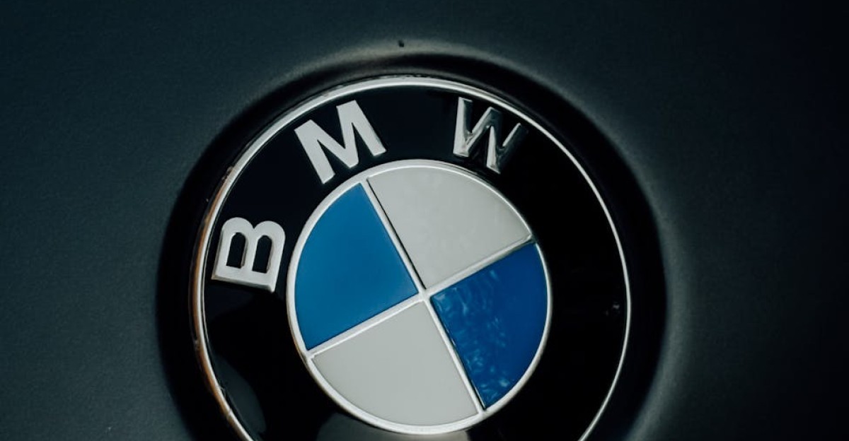 Detailed image of the iconic BMW logo displayed on a car hood