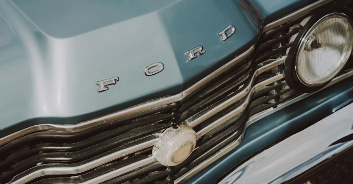 Close-up of a vintage Ford car s front grill capturing classic design elements
