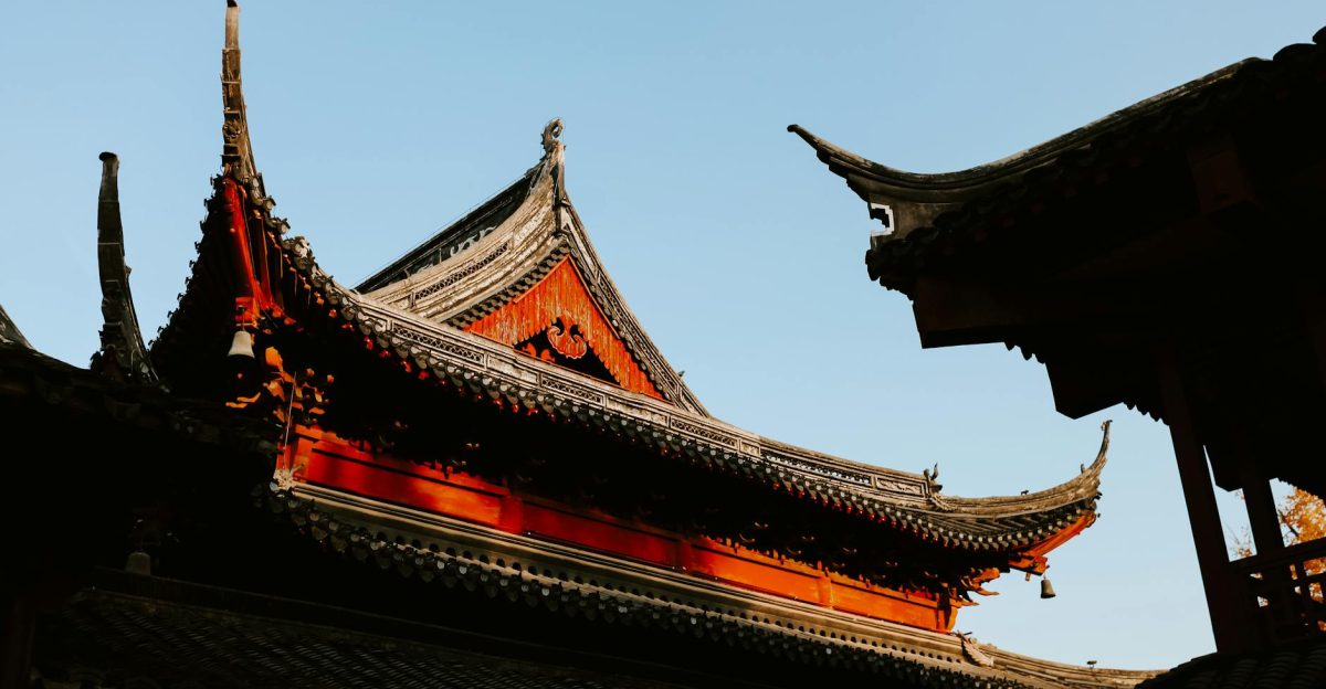 View of traditional Chinese temple roofs in Nanjing during autumn showcasing intricate architectural details
