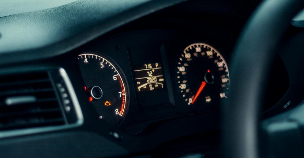 Detailed view of a car s dashboard featuring illuminated gauges and speedometer