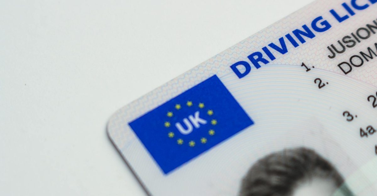 Detailed photo of a UK driving license showcasing EU flag and identity features