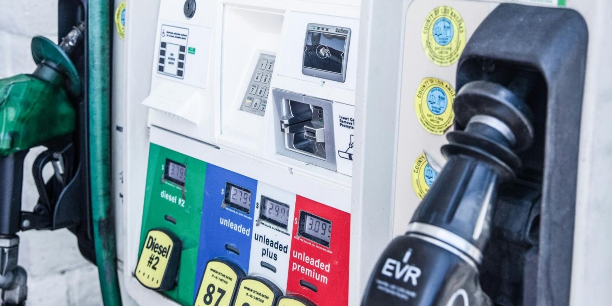 Close-up of a modern gas pump at a Los Angeles fuel station showing fuel options and digital display.