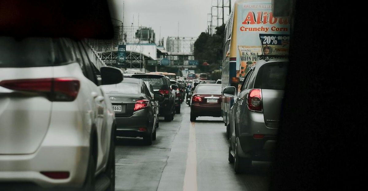 Heavy city traffic in overcast weather showcasing cars on a congested street