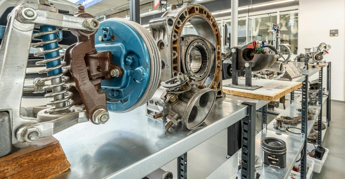 Showcase of metal engine components in an industrial workshop setting