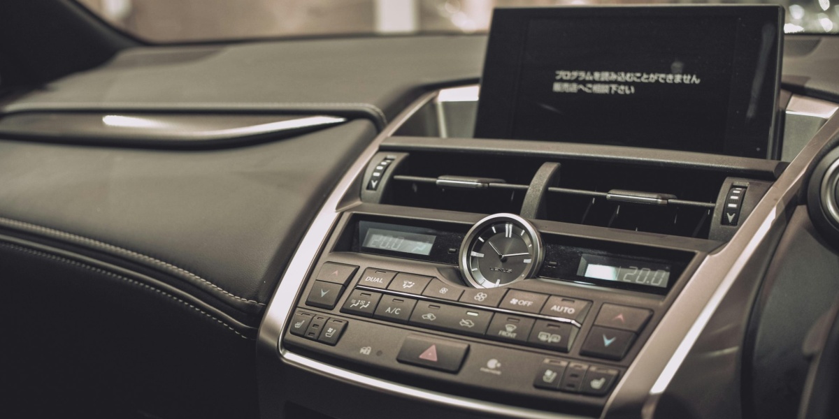 Close-up of a Lexus car interior showcasing the sleek dashboard and modern features.