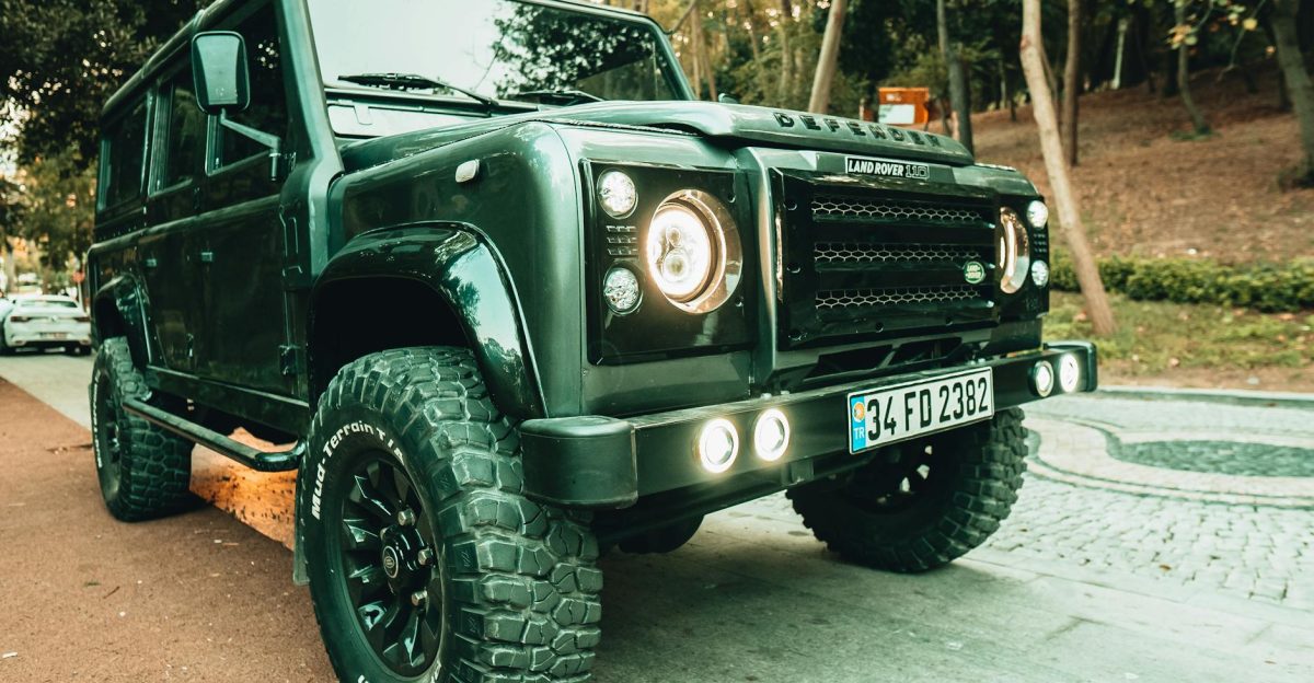 A rugged Land Rover Defender SUV parked on a street in Istanbul showcasing its robust design