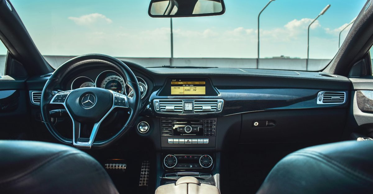 black Mercedes-Benz vehicle steering wheel