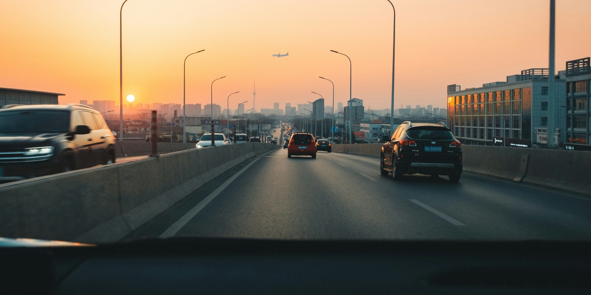 cars on road during sunset