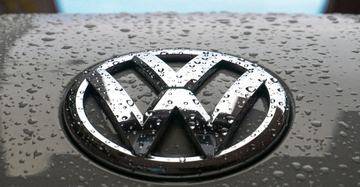water dew on silver Volkswagen car emblem