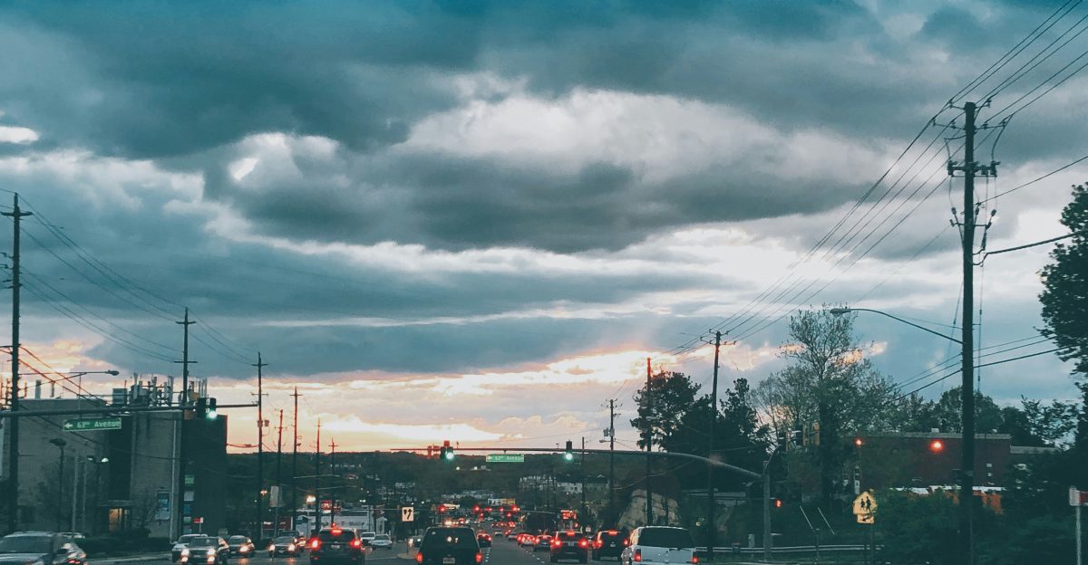 vehicles on road during golden hour