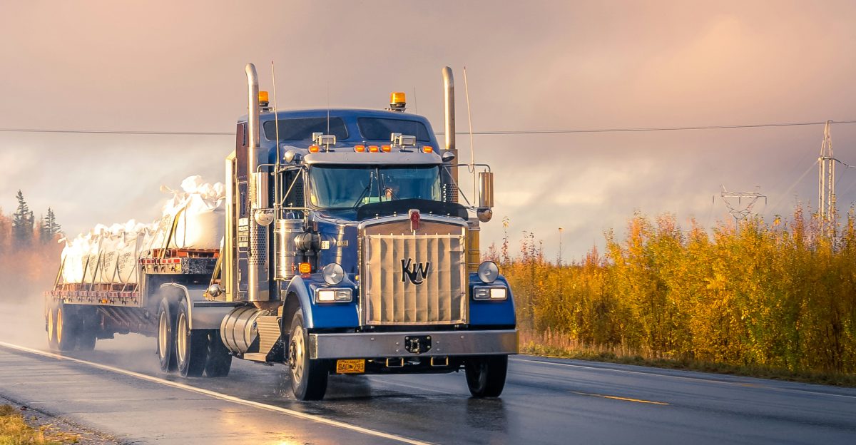 white and blue truck on road during daytime