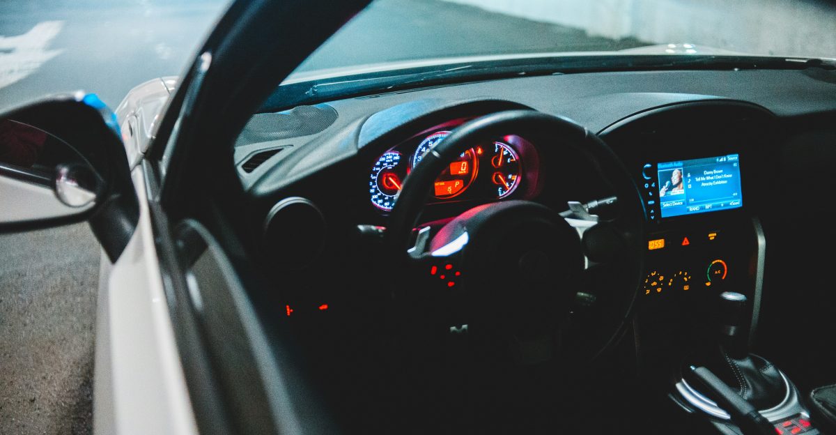 black car steering wheel during daytime