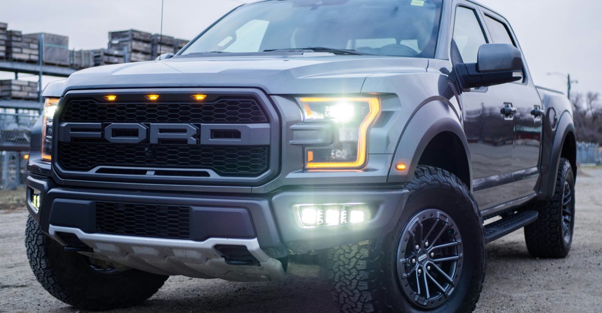 black chevrolet crew cab pickup truck on road during daytime