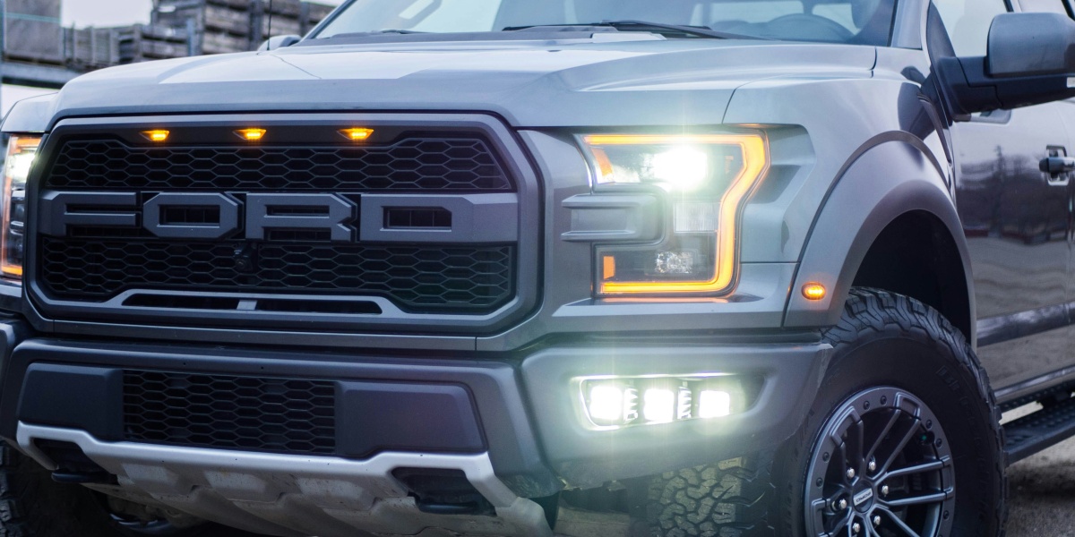 black chevrolet crew cab pickup truck on road during daytime