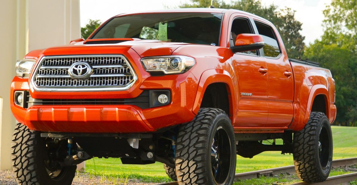 red chevrolet crew cab pickup truck