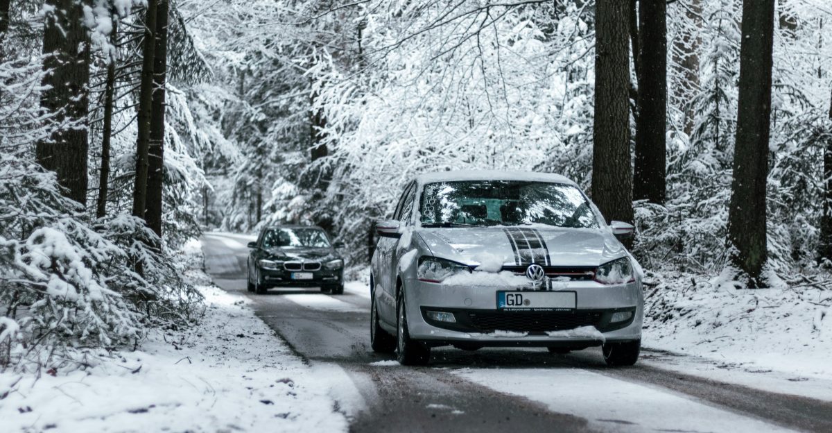 black bmw m 3 coupe on snow covered road during daytime