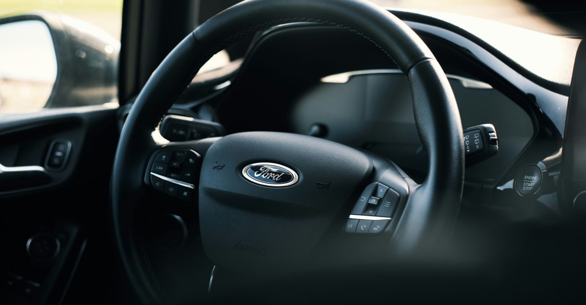 black nissan car steering wheel