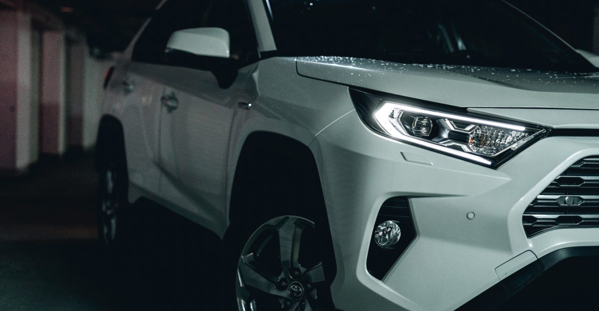 white and black car on black asphalt road