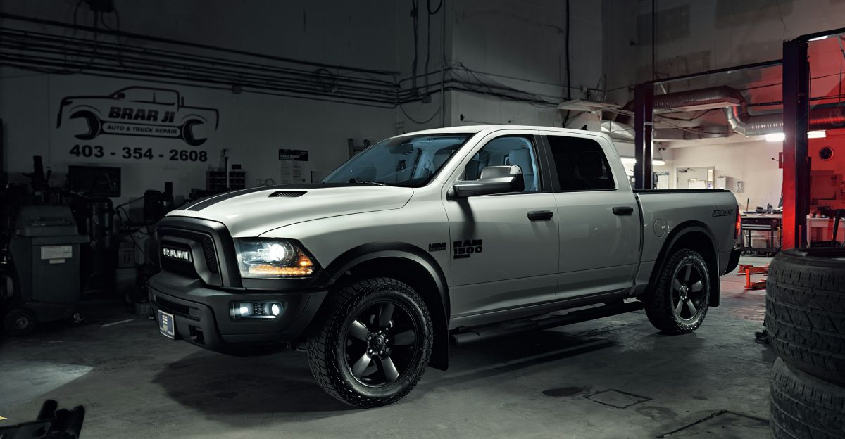 white crew cab pickup truck on road during daytime