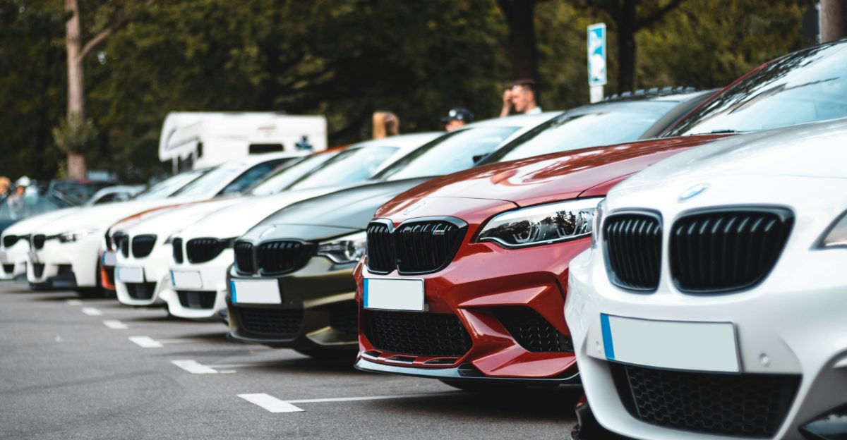 white and red bmw m 3 on road during daytime