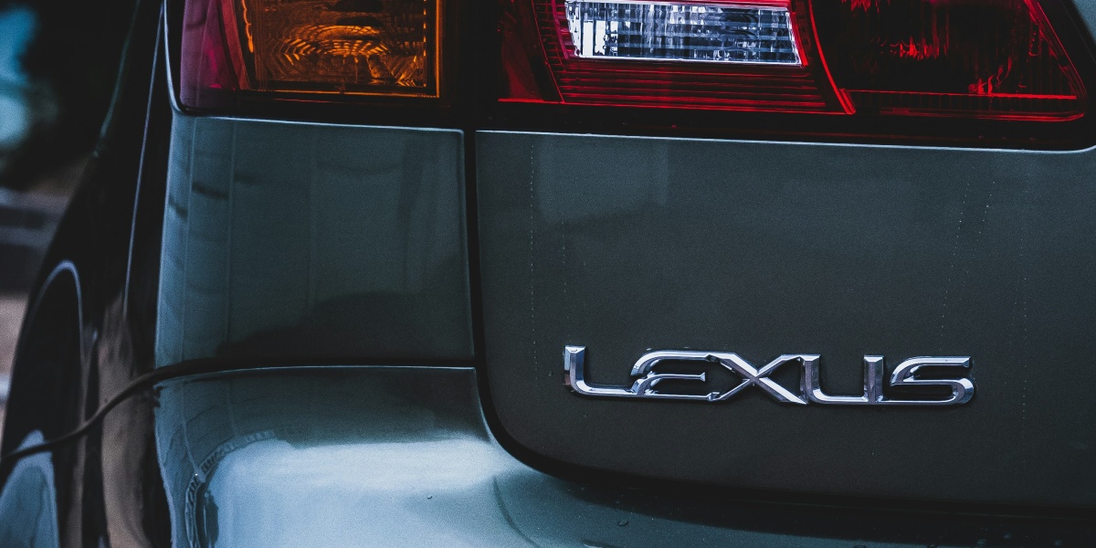 the back end of a car parked on the side of the road