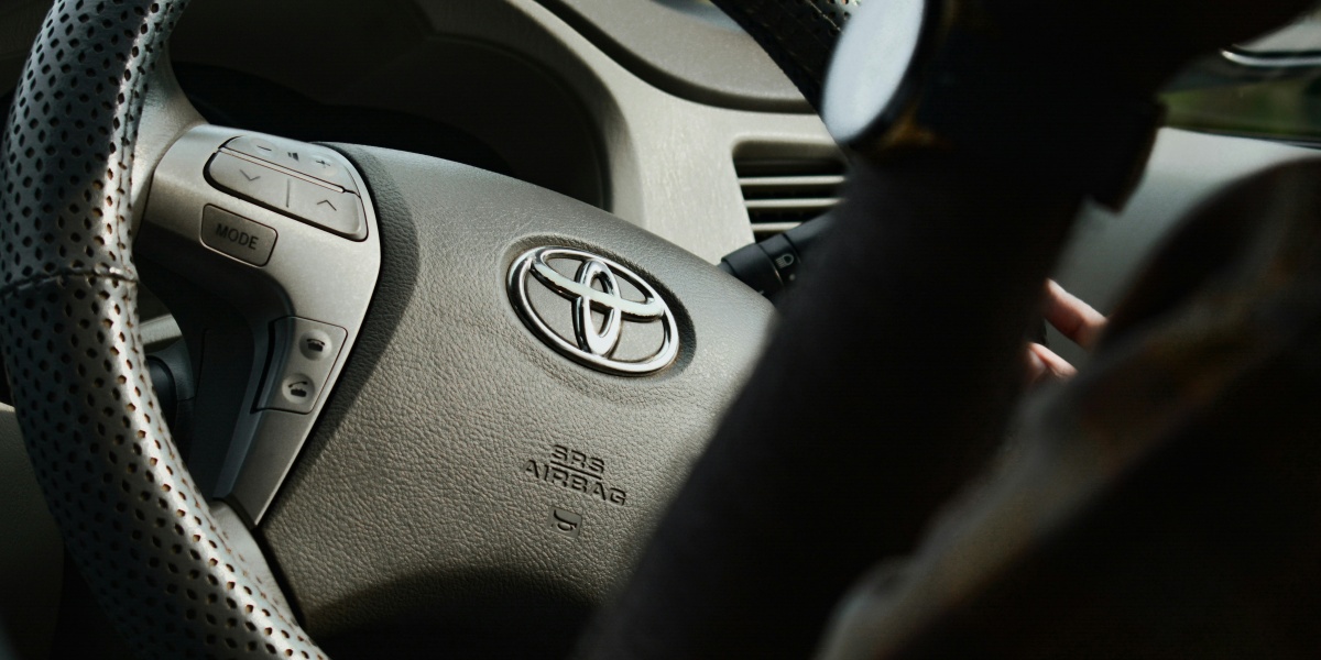a steering wheel of a car with a steering stick