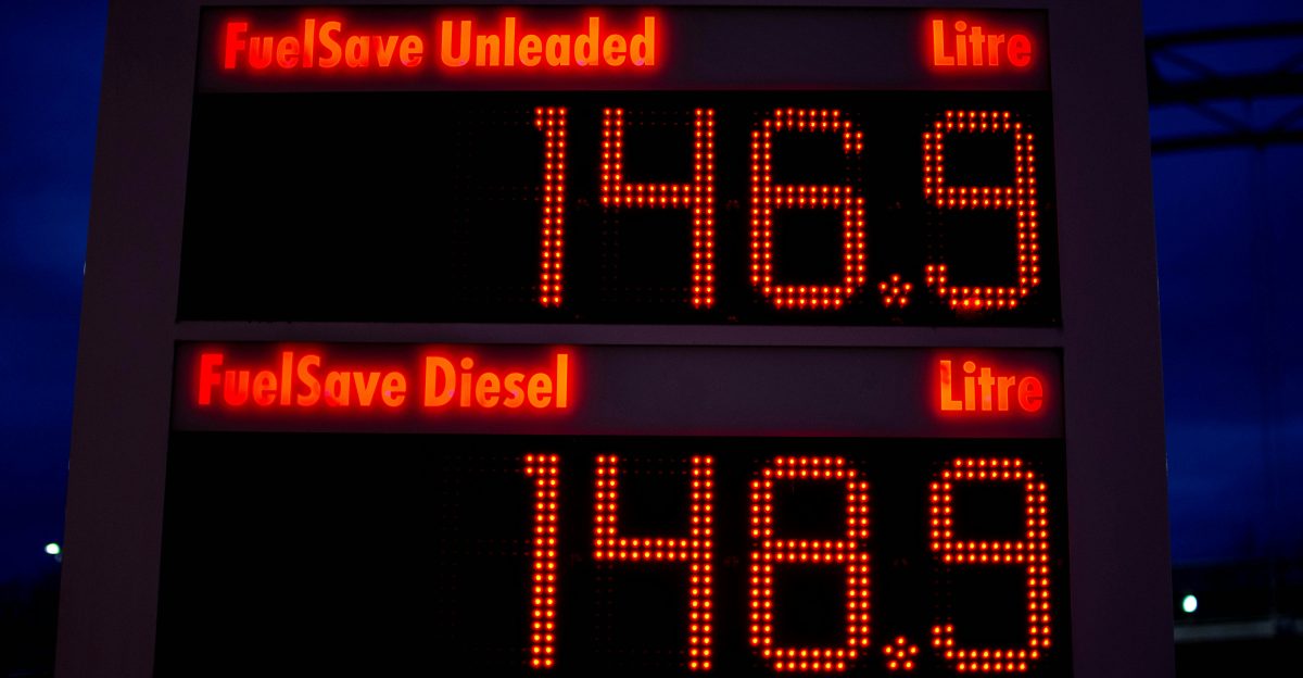 a gas station sign displays the time for gas prices