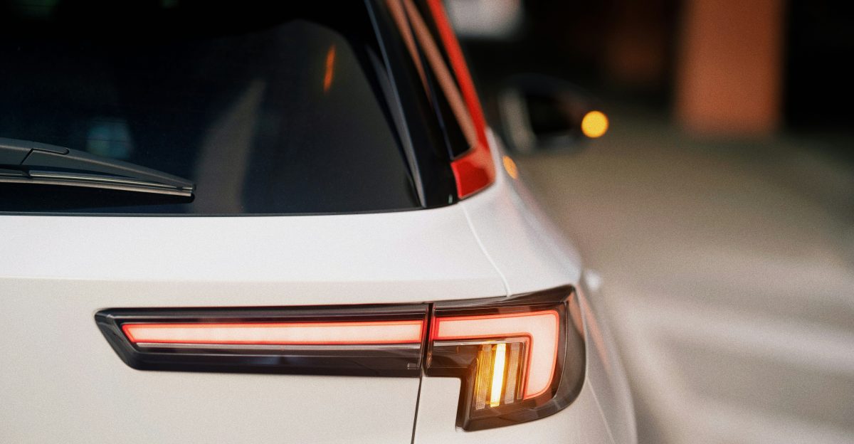 a close up of the tail lights of a white car
