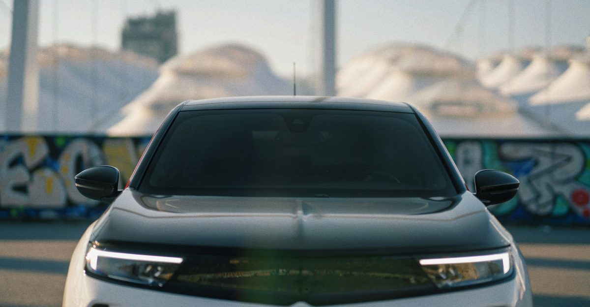 a close up of the front of a white car