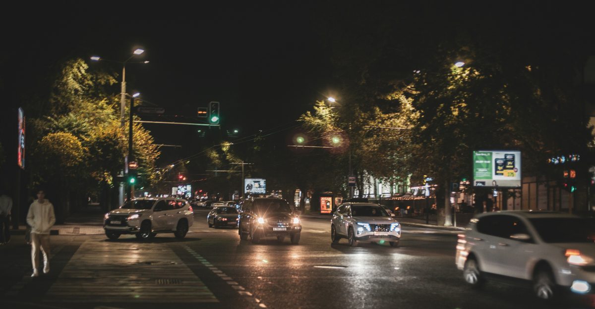 a street with cars on it at night