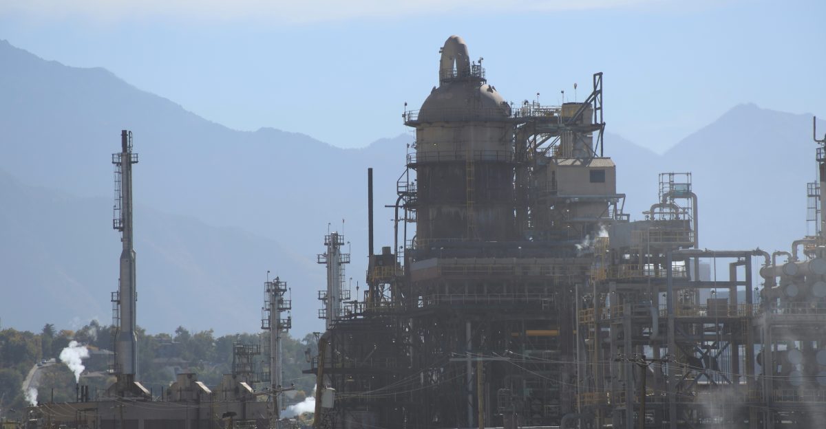 a large building with smokestacks