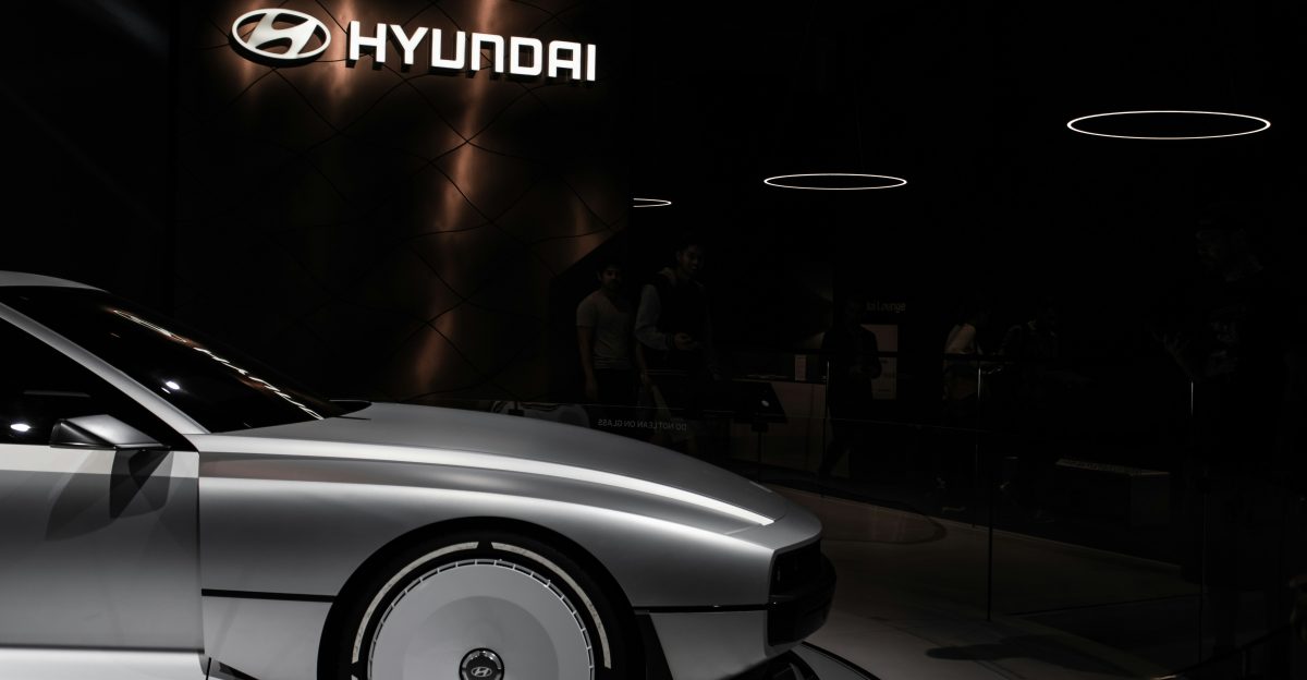 a white car parked in a showroom