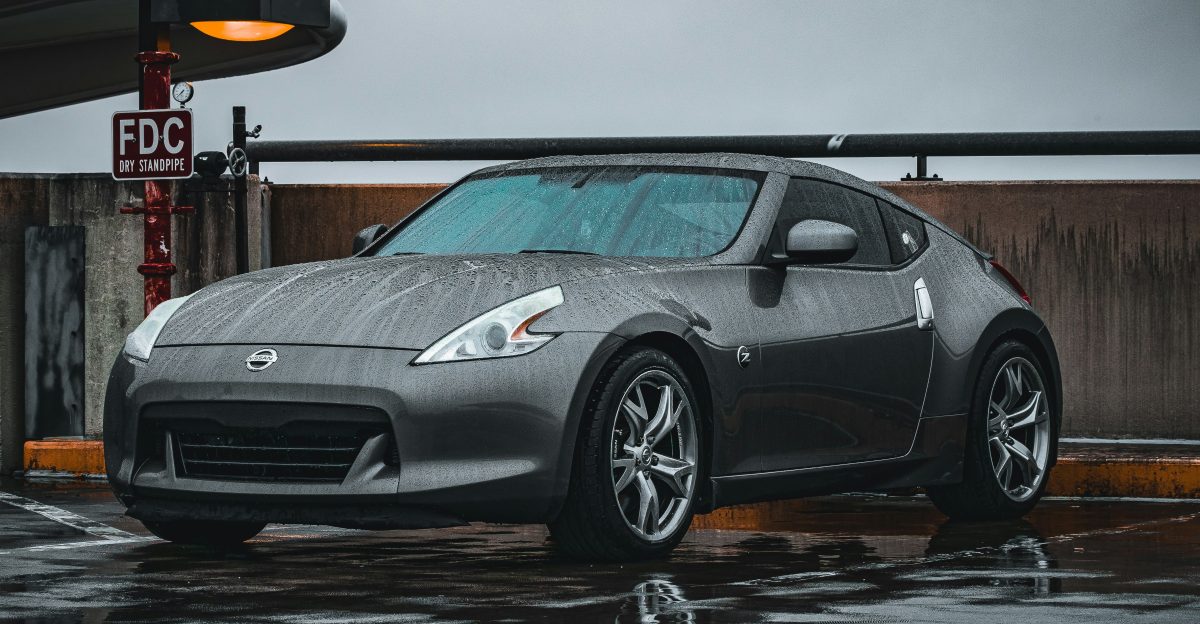 a silver sports car parked in a parking lot