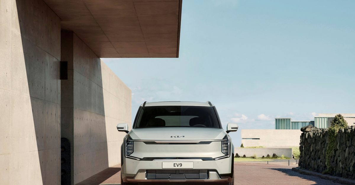 a white suv parked in front of a building