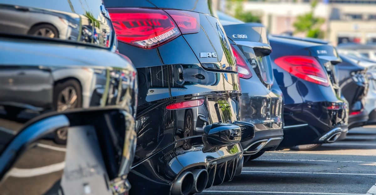 a row of parked cars in a parking lot
