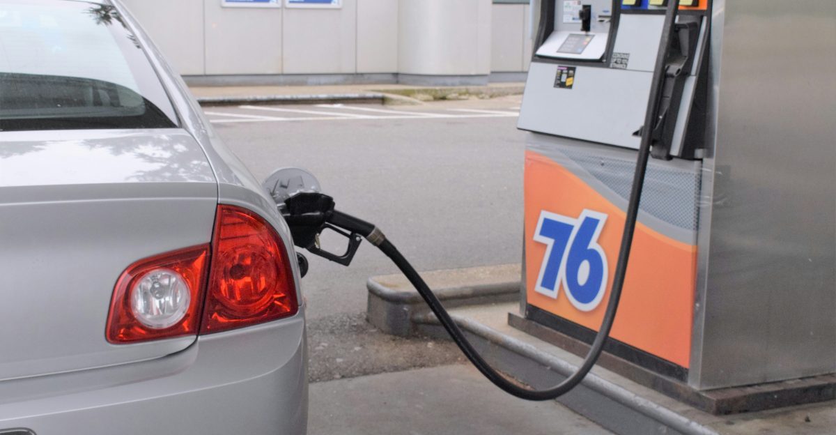 a car is parked at a gas pump