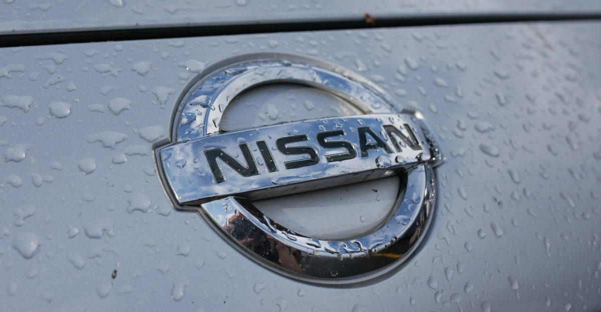 a close up of a nissan emblem on a car