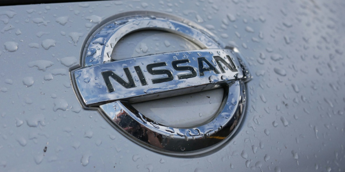 a close up of a nissan emblem on a car